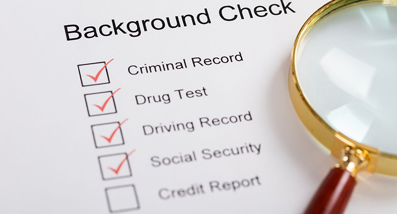 70454390 – high angle view of magnifying glass over background check form 70454390 - high angle view of magnifying glass over background check form